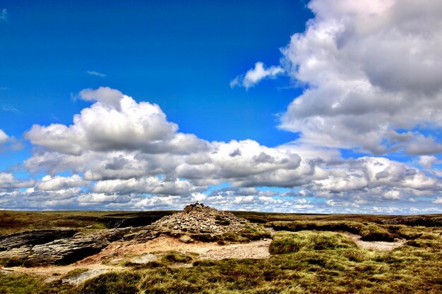 Low angle view of arid landscape against sky