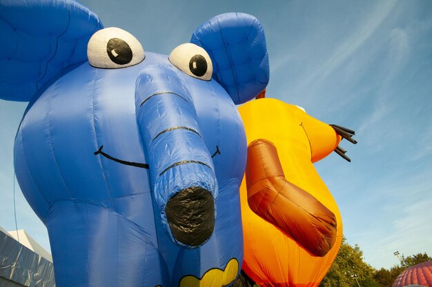 Low angle view of balloons against blue sky