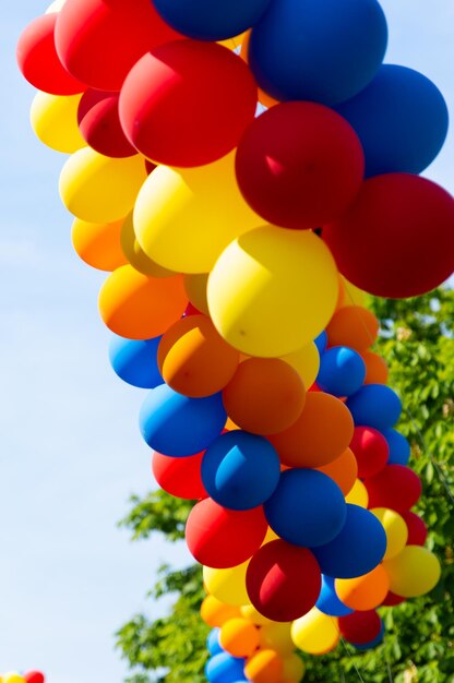 Low angle view of balloons against sky