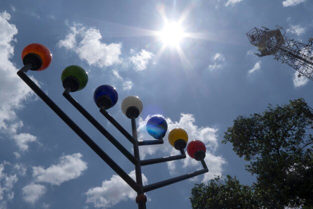 Low angle view of balloons against sky