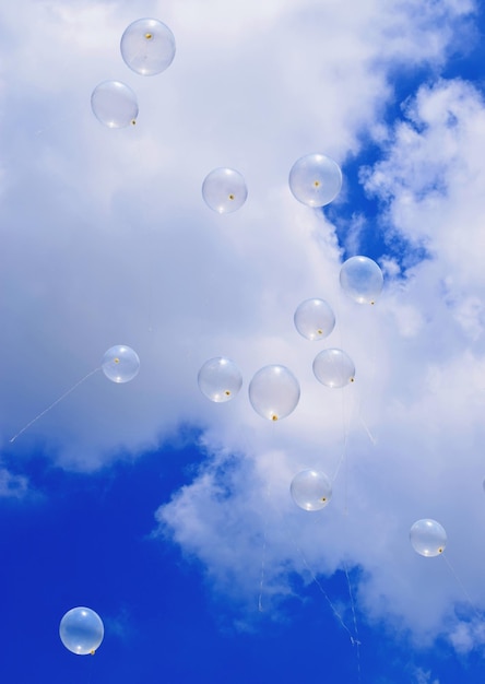 Low angle view of balloons against sky