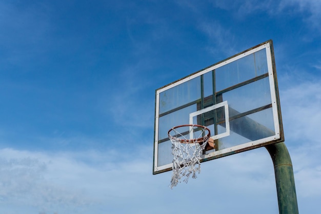 Low angle view of basketball ring on sky background Outdoor basketball hoop