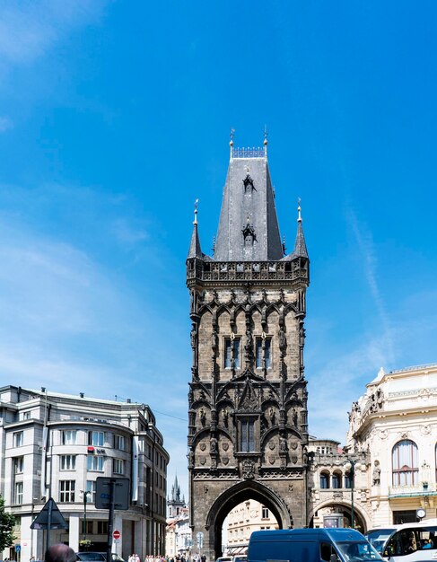 Low angle view of bell tower against blue sky