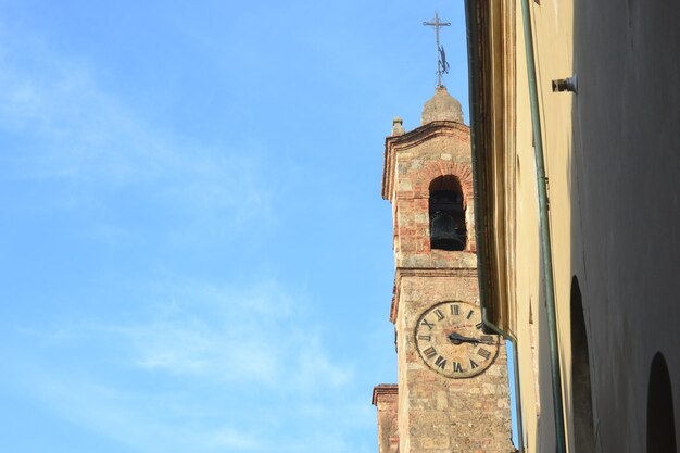 Low angle view of bell tower against sky