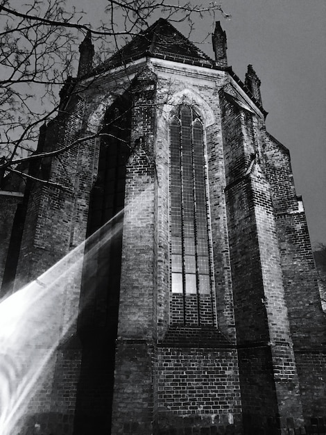 Low angle view of bell tower against sky