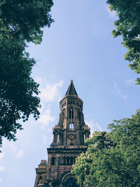 Low angle view of bell tower against sky