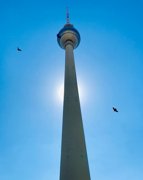 Low angle view of berlin tower against blue sky