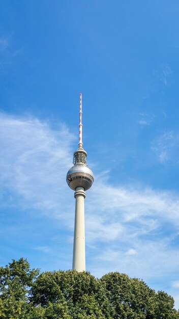 Low angle view of berliner fernsehturm against cloudy sky