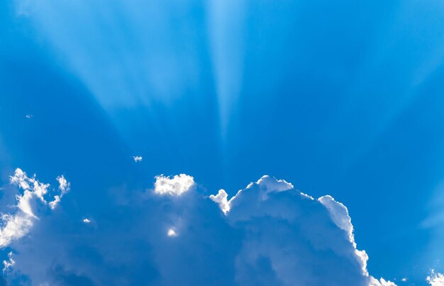 Low angle view of blue sky on sunny day