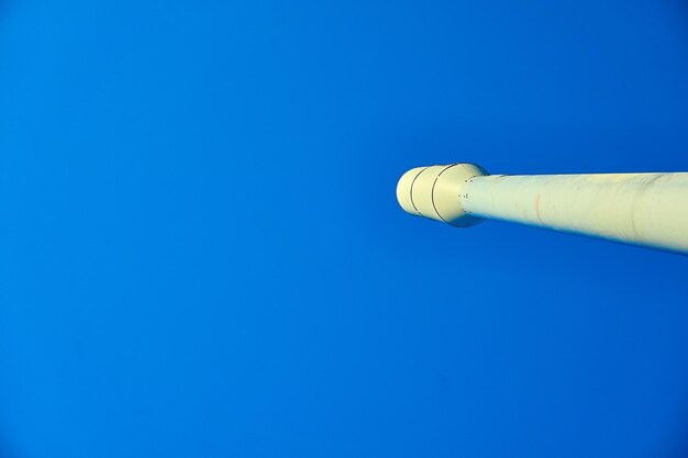 Low angle view of blue sky over white background