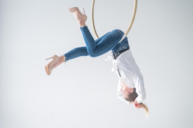 Low angle view of boy jumping against clear sky