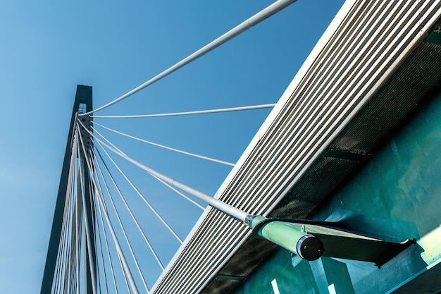 Low angle view of bridge against clear blue sky