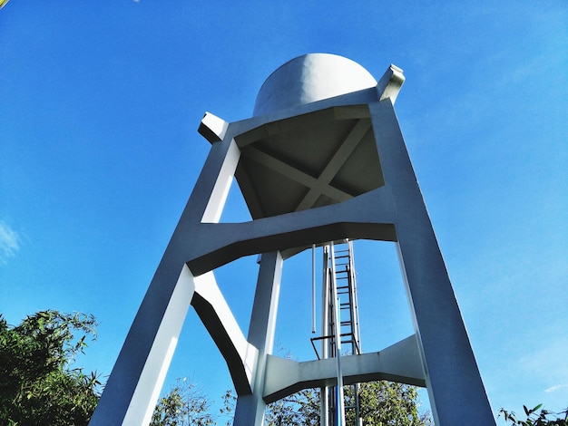 Low angle view of bridge against clear blue sky