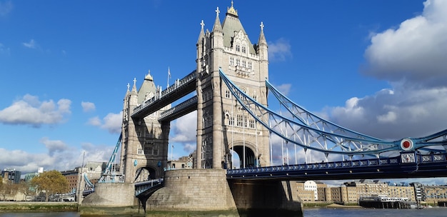 Low angle view of bridge against cloudy sky