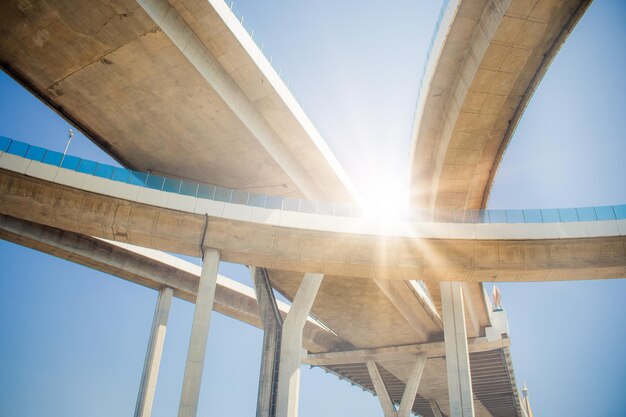 Low angle view of bridge against sky on sunny day