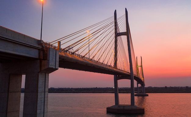 Low angle view of bridge against sky during sunset