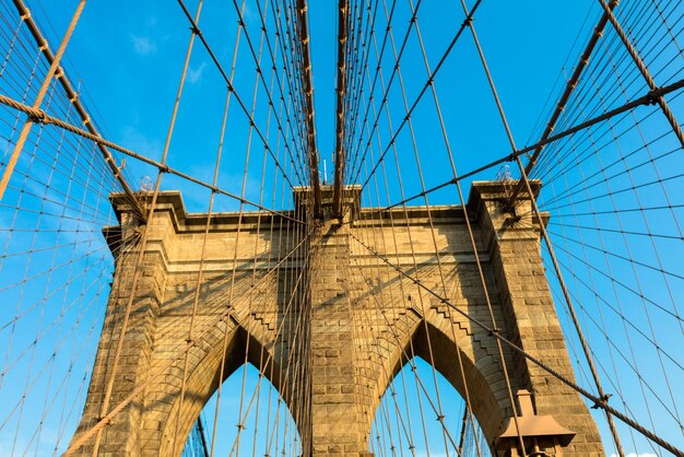 Low angle view of brooklyn bridge against sky