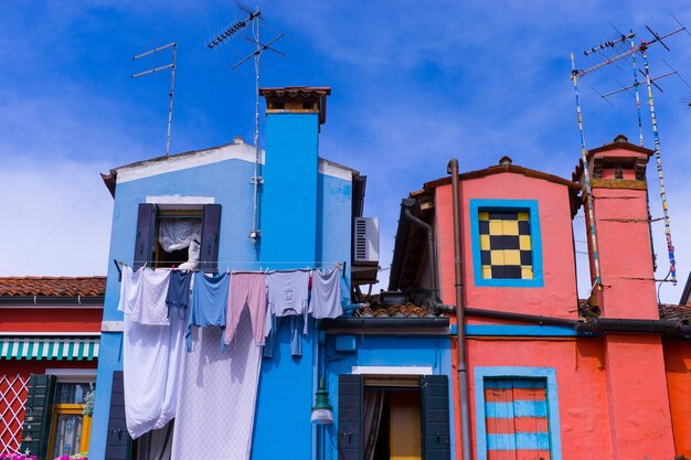 Low angle view of building against blue sky in murano island