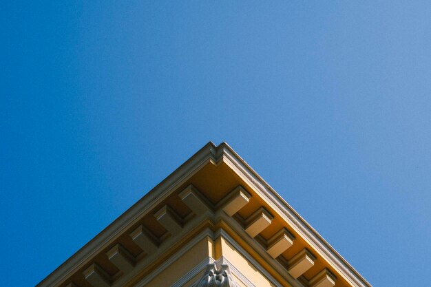 Low angle view of building against blue sky