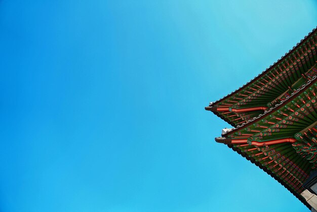 Low angle view of building against blue sky