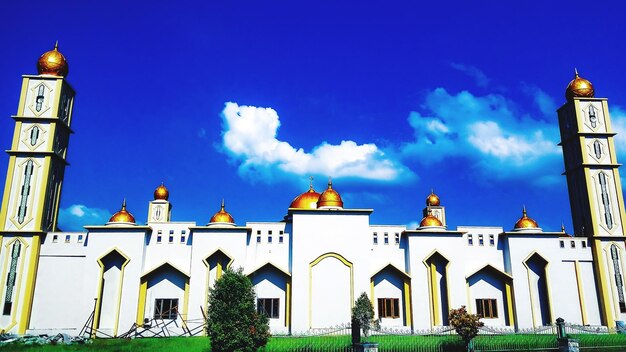 Low angle view of building against blue sky