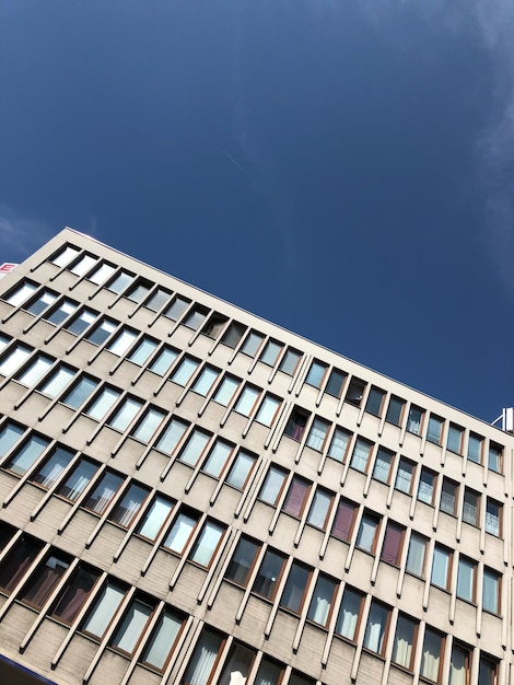 Low angle view of building against blue sky