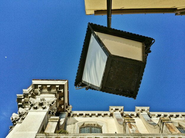 Low angle view of building against blue sky