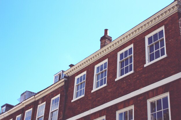 Low angle view of building against blue sky