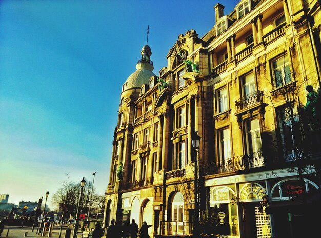 Low angle view of building against blue sky