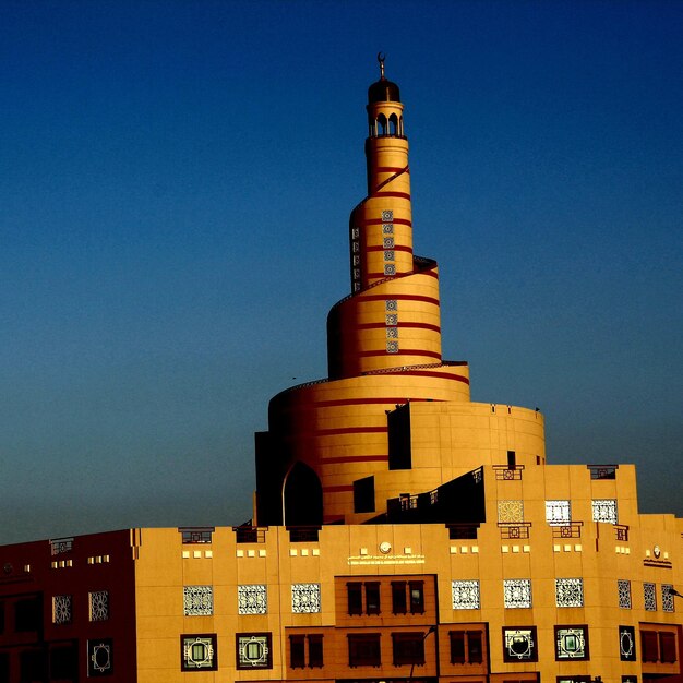 Low angle view of building against blue sky