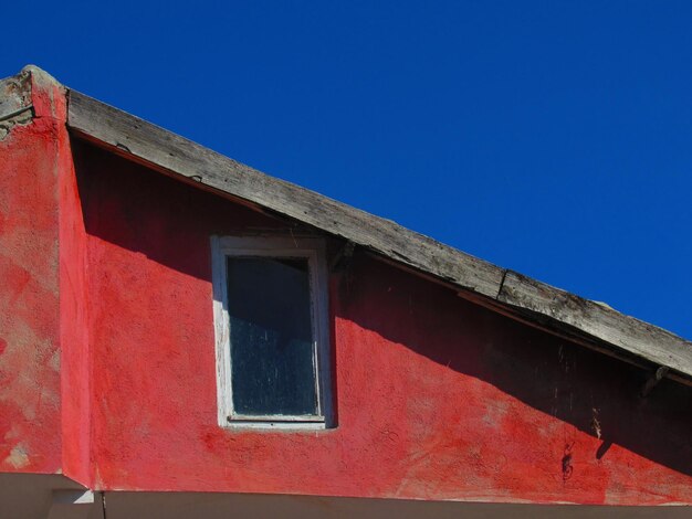 Low angle view of building against blue sky