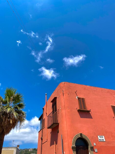 Low angle view of building against blue sky