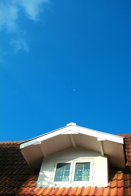 Low angle view of building against blue sky