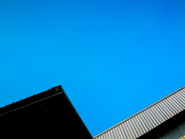 Low angle view of building against blue sky