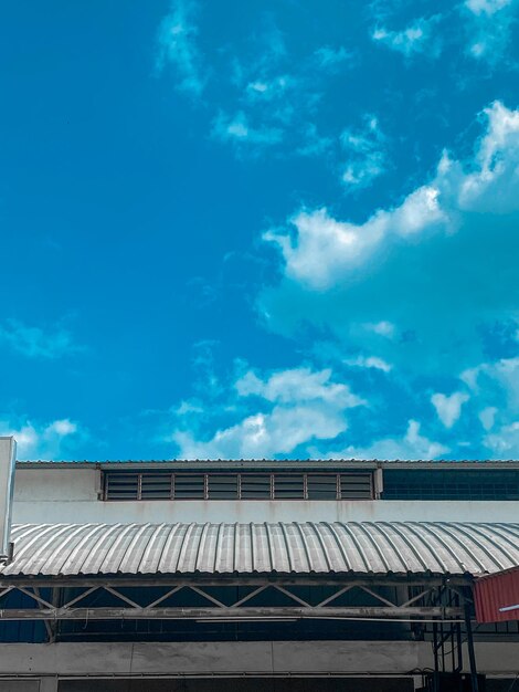 Low angle view of building against blue sky