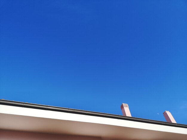 Low angle view of building against blue sky