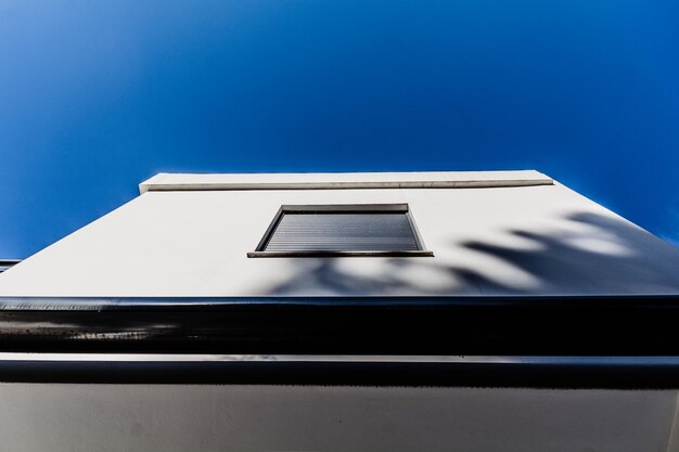 Low angle view of building against blue sky