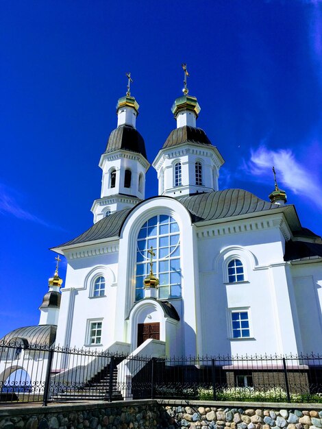 Low angle view of building against blue sky