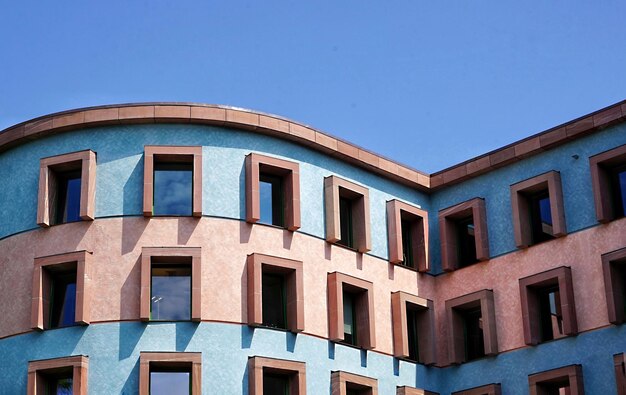 Low angle view of building against clear blue sky