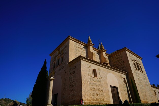 Low angle view of building against clear blue sky