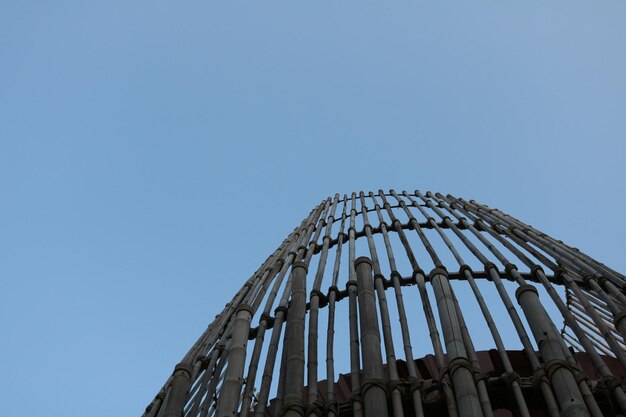 Low angle view of building against clear blue sky