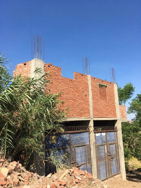 Low angle view of building against clear blue sky