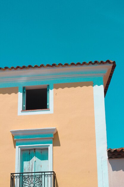 Low angle view of building against clear blue sky