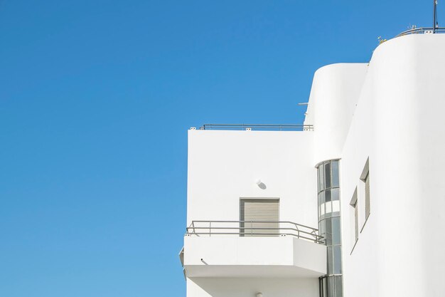 Low angle view of building against clear blue sky