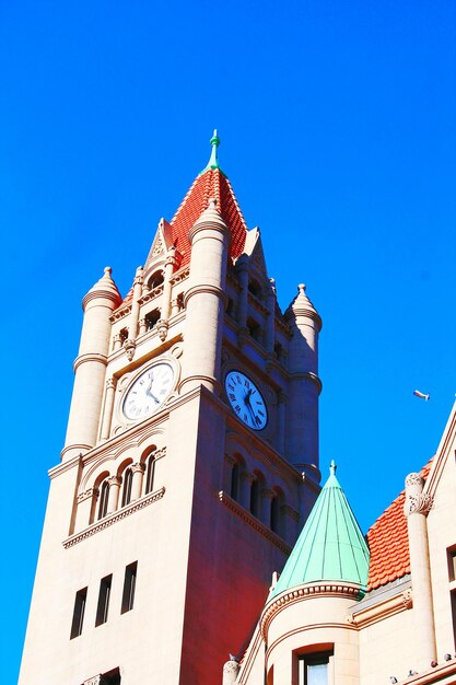 Low angle view of building against clear blue sky