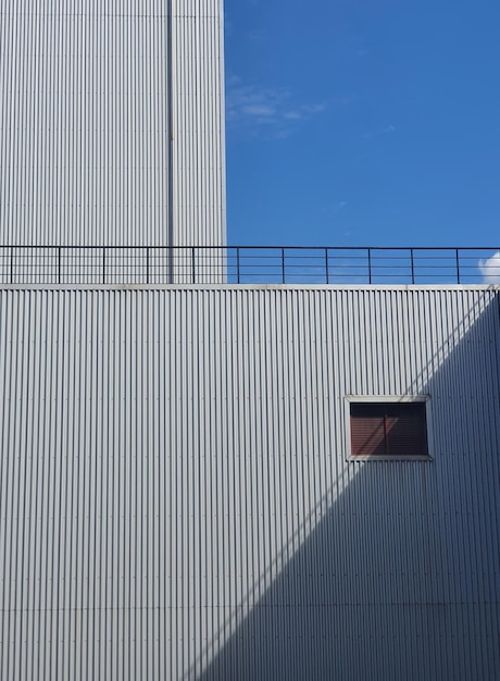 Low angle view of building against clear blue sky