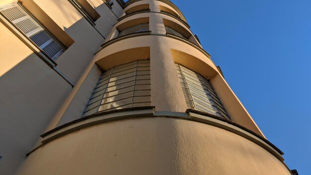 Low angle view of building against clear blue sky