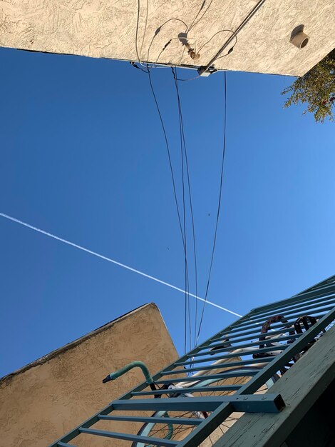 Low angle view of building against clear blue sky