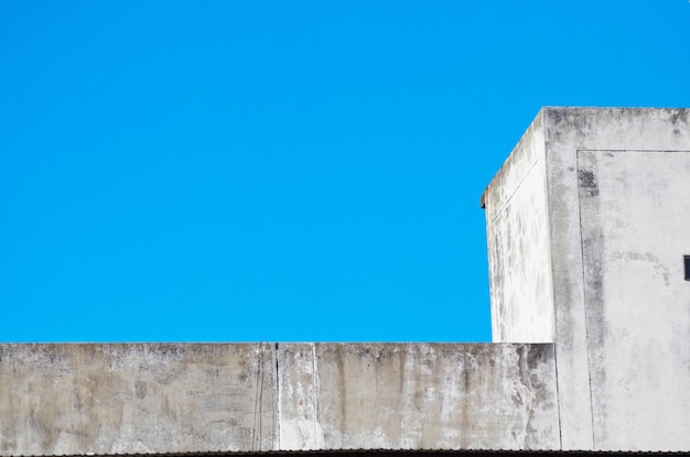 Low angle view of building against clear blue sky