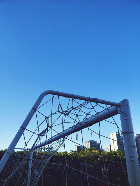 Low angle view of building against clear blue sky